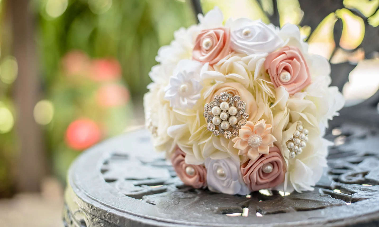 Pastel artificial bridal bouquet with decorative beads and satin details