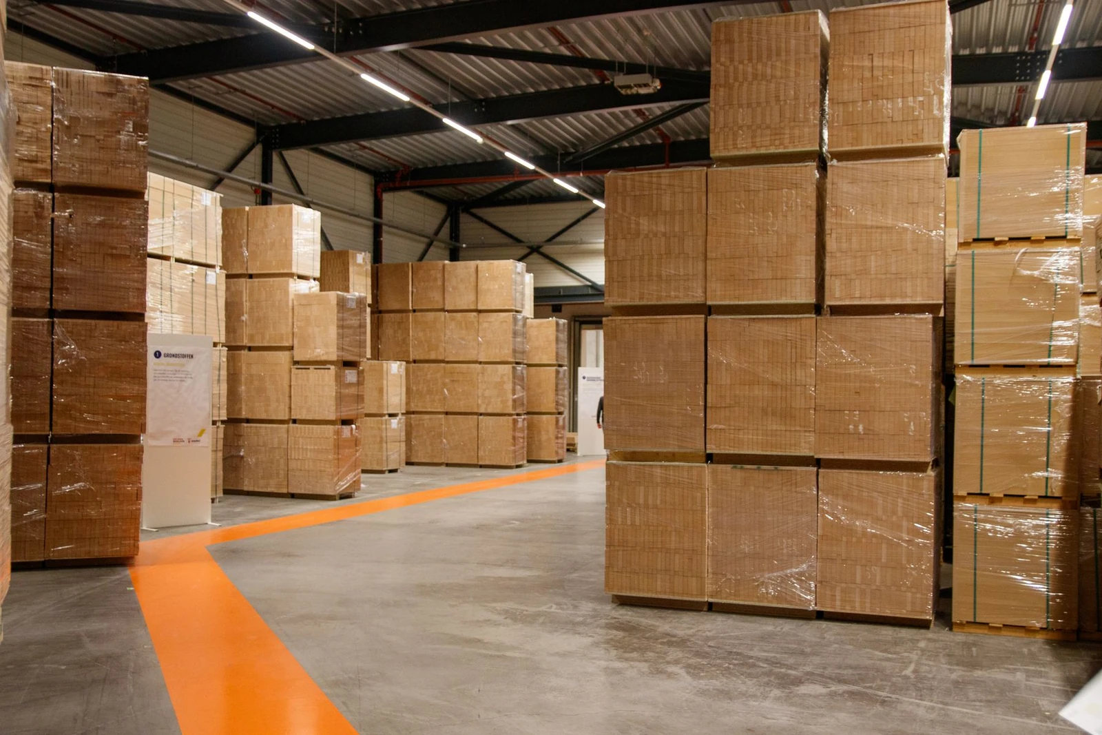 Industrial warehouse with stacked cartons and palletized loads
